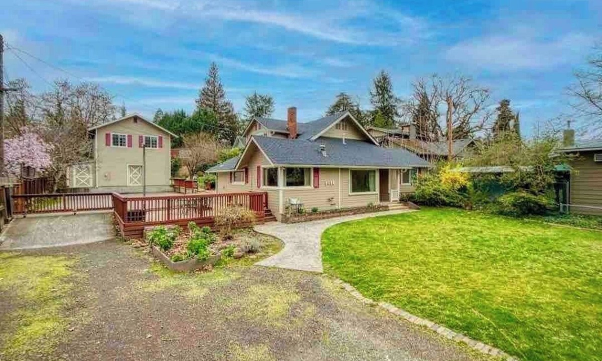Medford House | Bring everyone together while enjoying the privacy of three separate living spaces. This unique Medford retreat features a spacious main home, two private guest homes, a seasonal pool, hot tub, fully equipped kitchens, and room for the whole family.