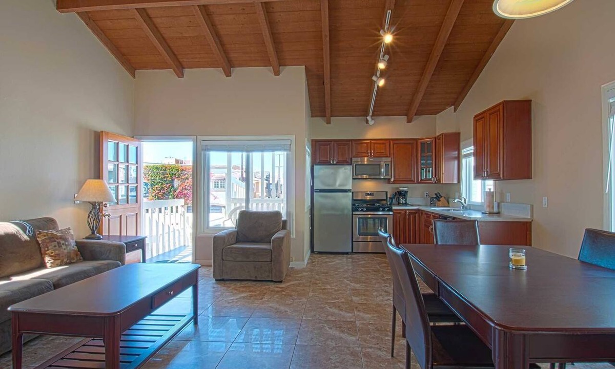 West Newport Condo | Fantastic and newly-remodeled upper unit just one house from the warm sand