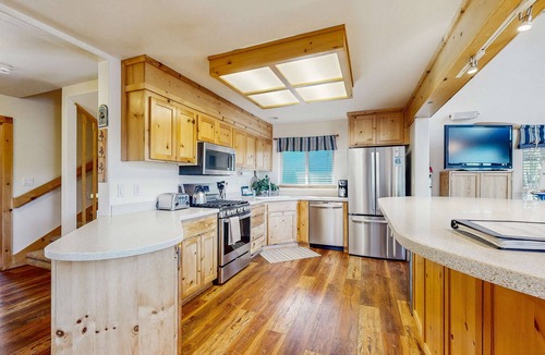 Serene Lakes House | Family-friendly, lakefront getaway with a gas fireplace, furnished deck, & views