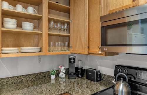 Corona Apartment | First floor 1BR condo with patio, king bed, pool and gym access.