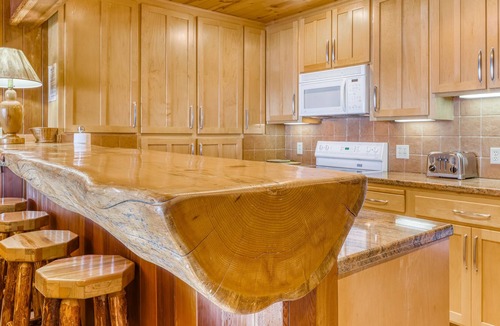 Brockway Condo | Lakeside condo with water views, private beach, dock, buoy, and wood fireplace