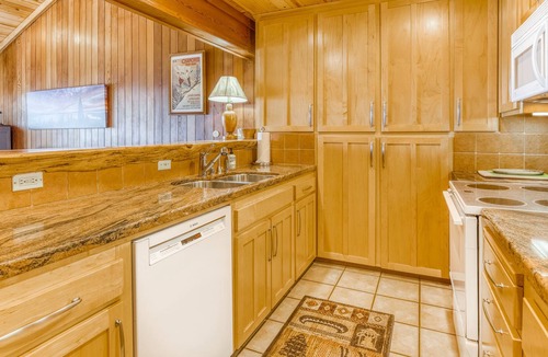Brockway Condo | Lakeside condo with water views, private beach, dock, buoy, and wood fireplace