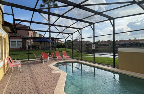 Sunset Lakes House | Luxury Villa With Large Private Patio & South Facing Pool Overlooking a Lake