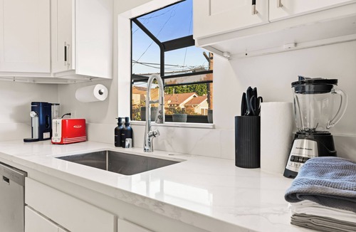 Eastside Apartment | Oversized Furnished 1BR in Rose Park with King Bed, W/D & Parking