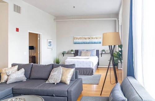 Gaslamp Quarter Hotel | Spacious 1 BR 700 sq ft loft suite with free parking, steps to the Convention Center and Gaslamp dining. Ideal for business or group travel.