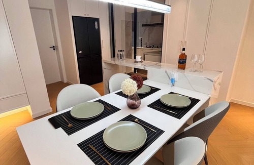 Downtown Shanghai Apartment | Spacious master bedroom equipped with a private walk-in closet near Yuyuan