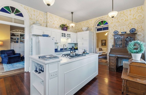 Jacksonville House | Stay in Jacksonville’s iconic 1861 B.F. Dowell House. Walk to Britt Festival, downtown, restaurants, and wine tasting while enjoying stained glass, marble fireplaces, private baths, gardens, and timeless historic charm.