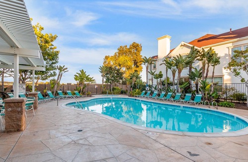 East Side Capistrano House | Sunny dog-friendly townhome with pool, close to beach, fireplace, & washer/dryer