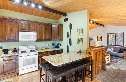 Moonridge Cabin | Sunset Mountain Retreat By Destination Big Bear: Nestled in Lower Moonridge! 1 Mile Away from Bear Mountain Ski Resort, Golf Course and Zoo! Reverse Floor Plan! Air Hockey Game Table!