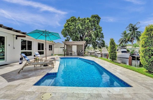 Citrus Isles House | Waterfront luxury pool home near FLL Airport.