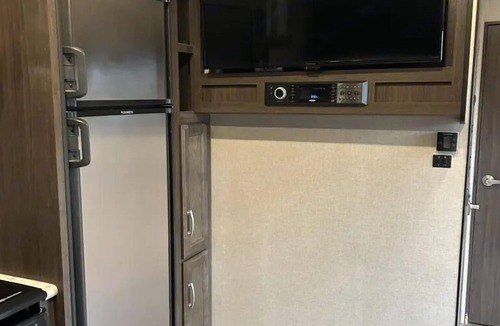 Mira Monte House | Winnebago camper set up on beautiful property with resort style pool and jacuzzi