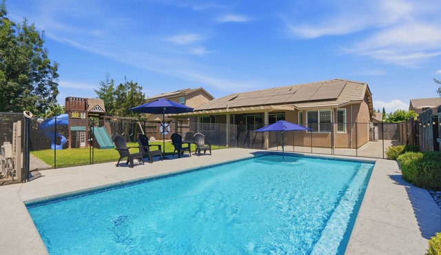 4+2 with a fenced in pool, large yard, feel right at home!