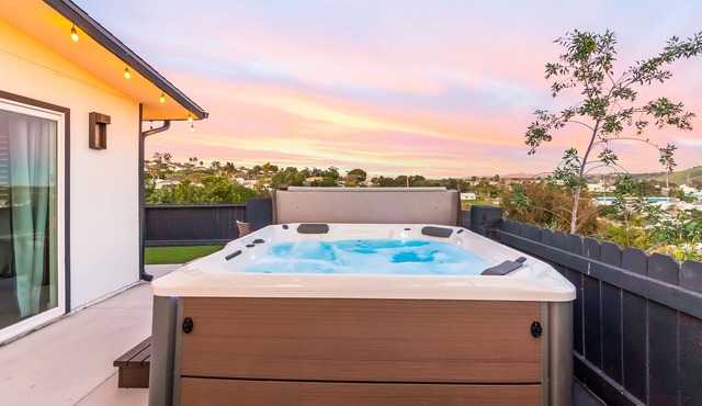 Breezy dog-friendly house with hot tub, central AC, game room, & washer/dryer