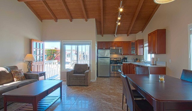 Fantastic and newly-remodeled upper unit just one house from the warm sand