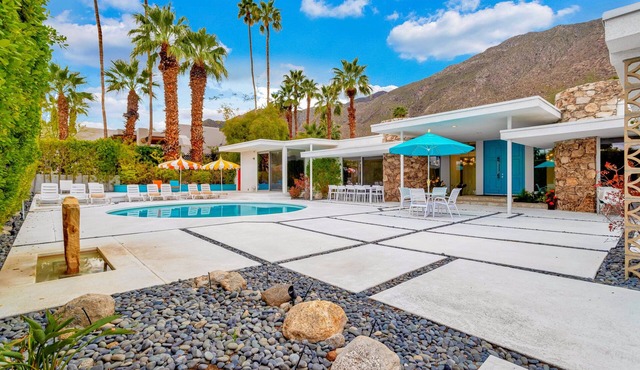 Mid-century modern estate with a pool, hot tub, gourmet kitchen, and fireplace