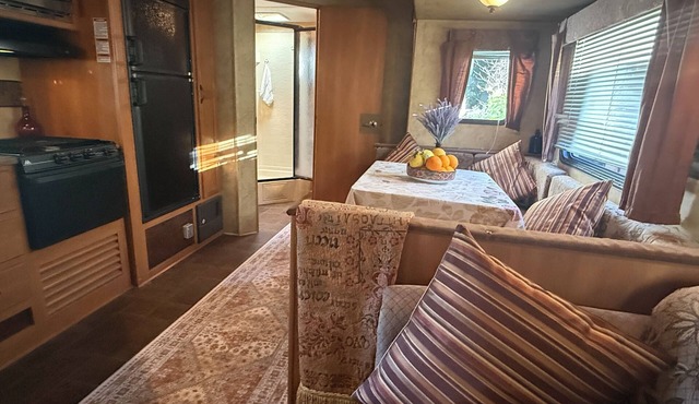 Ojai Pixie Suite spacious contemporary trailer, outdoor living area, rose garden
