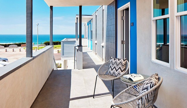 Steps from the Sand: Room with Ocean Panorama in Modern Setting