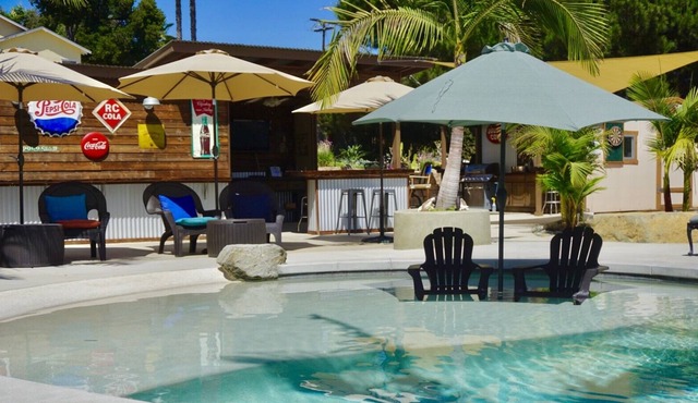 Sunshine and privacy in a resort style setting with pool/jacuzzi and outdoor bar