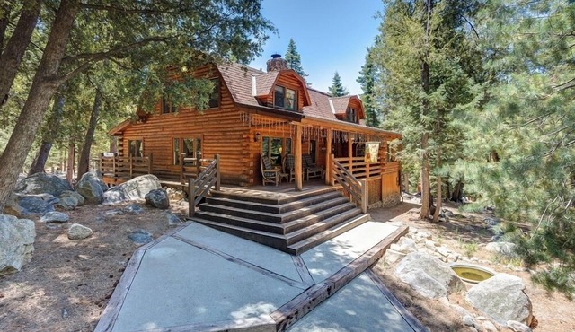 This newer, spacious 2600 sq. ft 2-story log home is well insulated with thermostatically controlled central heating. There are 4 large bedrooms and the Master Suite is complete with a king size brass bed with a separate sitting area, 25" Color Tele