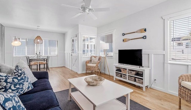 Updated 2nd-floor retreat with deck, AC, 2 car parking- steps from beach