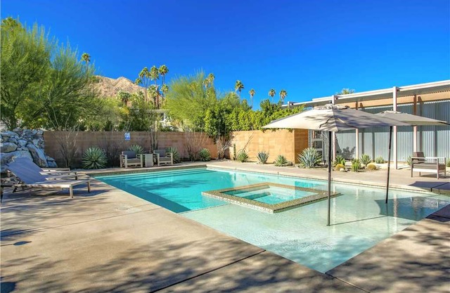 MID-CENTURY MODERN home is in the historic Little Tuscany neighborhood of Palm Springs